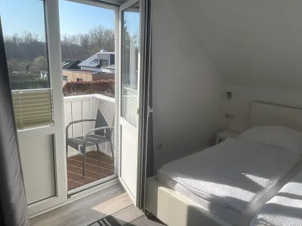 Schlafzimmer mit Balkon