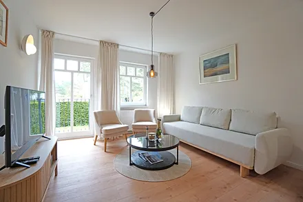  Wohnzimmer mit Schlafcouch