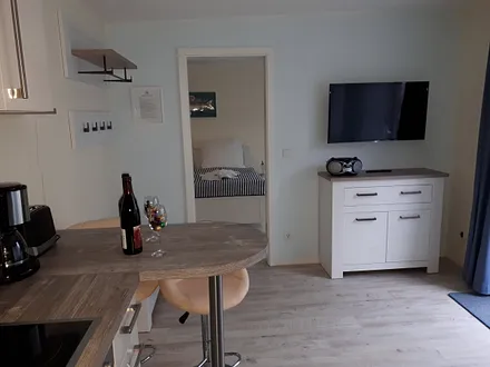 Wohnraum mit Fernseher, CD Player/Radio und kostenfreien WLAN