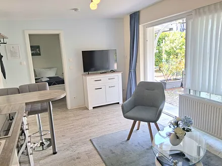 Wohnraum mit Fernseher, CD Player/Radio und kostenfreien WLAN