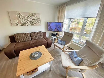 Wohnbereich mit TV und Relax Sessel