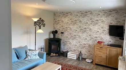 Wohnzimmer mit Kamin 