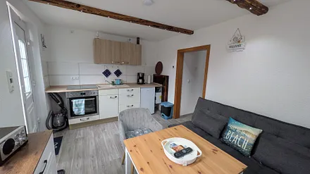 Wohnzimmer mit Küchenzeile 