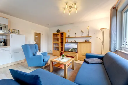 mit Schlafcouch & Flat-TV