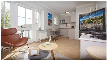 komfortabler Wohnbereich mit einer Schlafcouch (Aufbettungsmöglichkeit 1,40 m x 1,90 m), Couchtisch, Stehlampe sowie einer Kommode mit Flachbild-TV