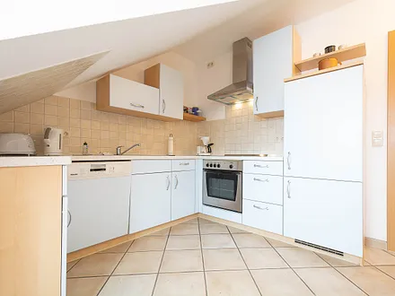 Die voll ausgestattete separate Küche