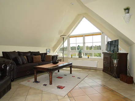 Das gemütliche Wohnzimmer mit Sitzecke