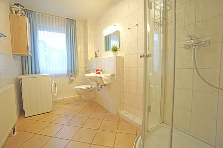 Duschbad mit Waschmaschine