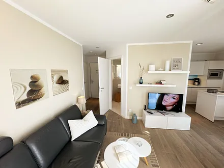 Wohnbereich mit Couchecke, Leselampe, iPad Air, Smart-TV, SONOS-Musikanlage mit DAB Radio sowie ein Festnetztelefon gehören zur elektronischen Ausstattung