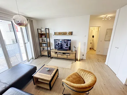 gemütlicher Wohnbereich mit Couch und Sessel