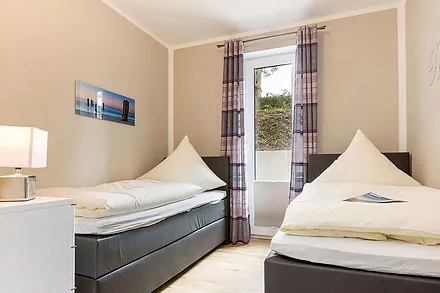 Zweites Schlafzimmer mit zwei Einzelbetten