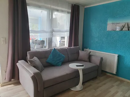 Wohnzimmer mit Schlafcouch 180 x 200 mit Topper