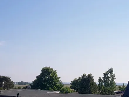 Blick auf das Achterwasser vom Balkon und der Wohnung