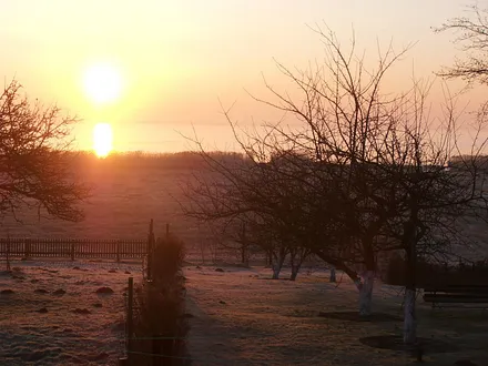 Sonnenaufgang über dem  Bodden von unserer FW aus zu sehen