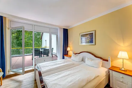 Schlafzimmer mit Zugang auf die Dachterrasse