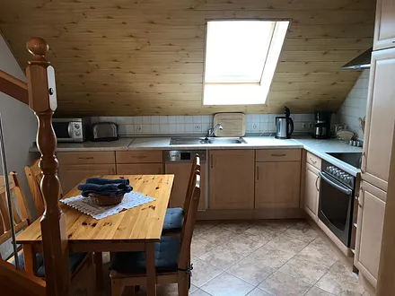 Wohnküche mit Aufgang zum zweiten Schlafbereich