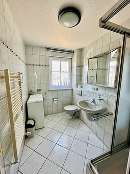 Duschbad mit Waschmaschine