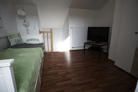 Mansardenzimmer mit Ausziehbett