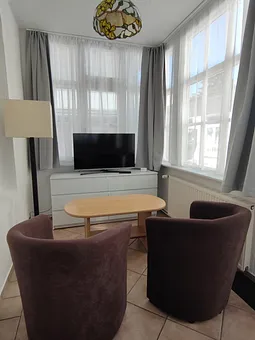 TV-und Sitzbereich in der Veranda