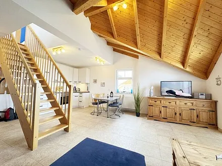 Wohnbereich mit Treppe nach oben