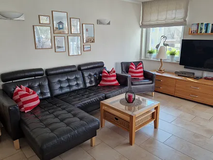 Wohnzimmer Sitzecke mit Ledermöbeln + TV