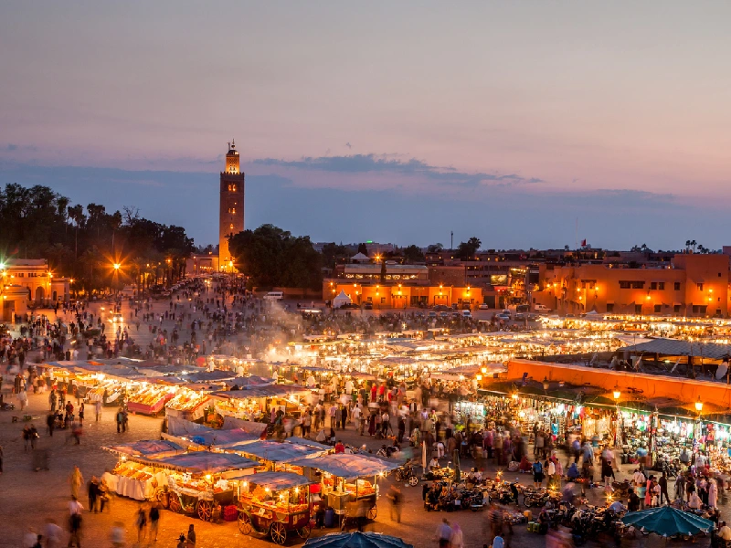 Aerial view of Jemaa el-Fnaa square bustling with life in Marrakech.