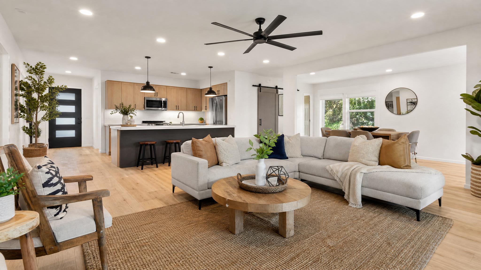After transformation showing the modern open-plan living room ready for short-term rentals.