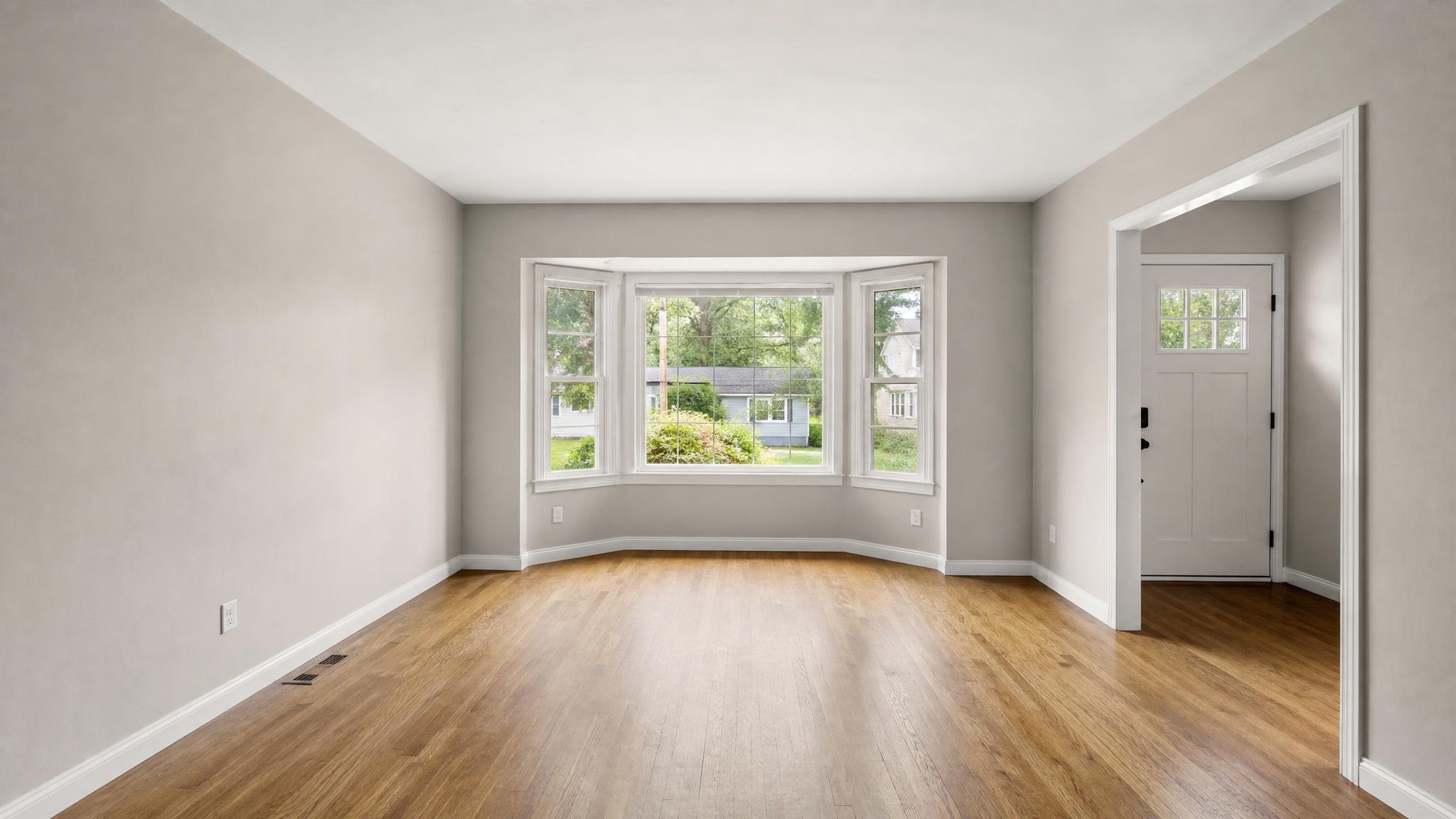 Before image of the empty small living room.