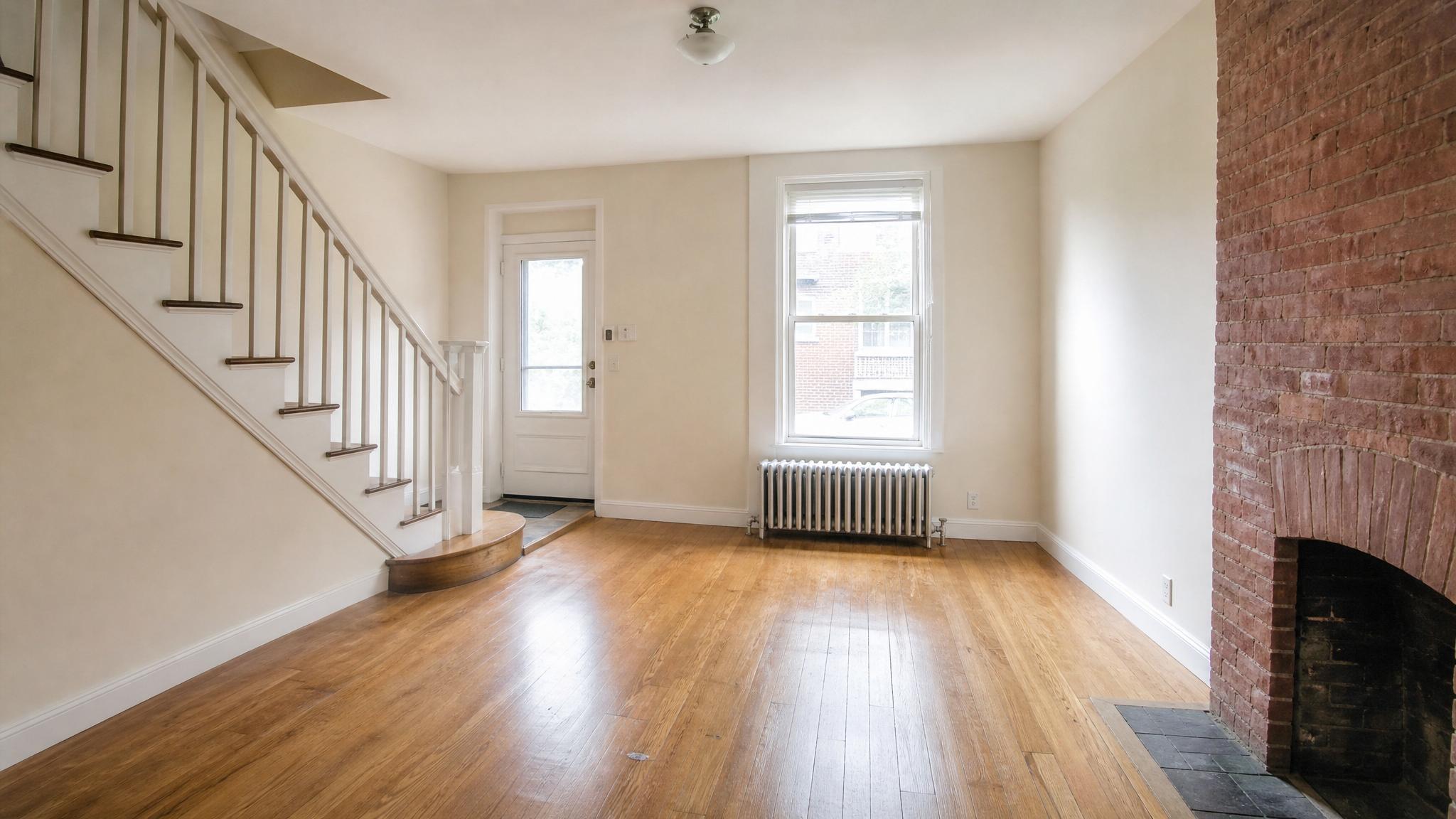 Before image of a small living room in a townhouse