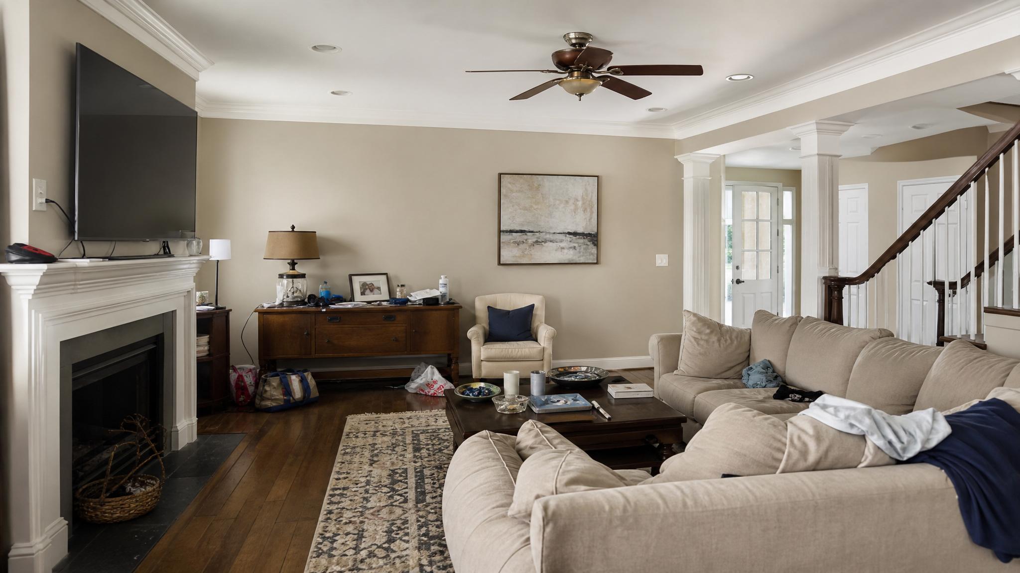 A poorly staged living room with clutter and unflattering angles