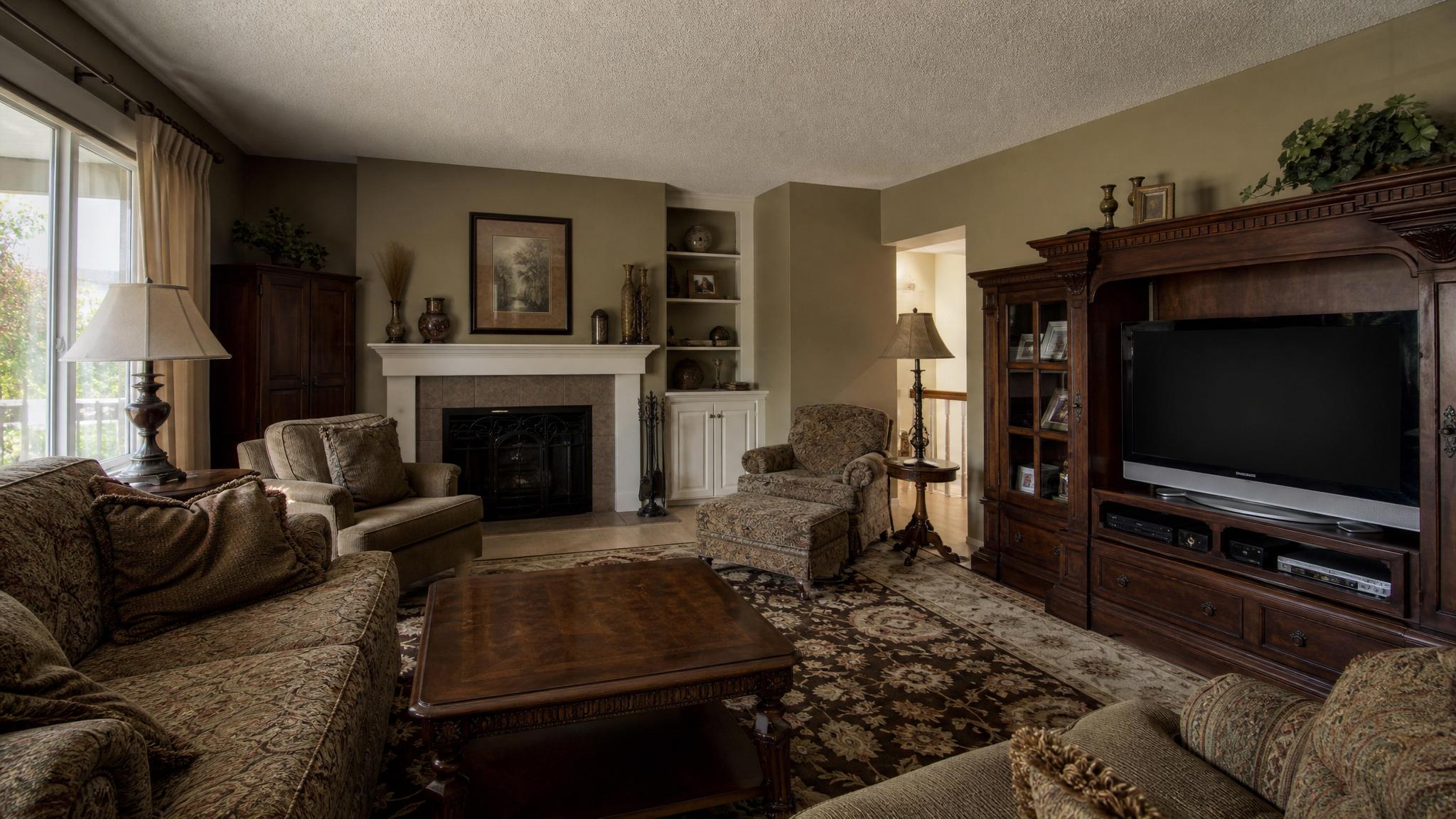 Before image showing heavy furniture and dull color palette