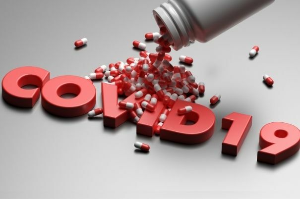 Scritta Covid-19 con Pillole Sparse Intorno