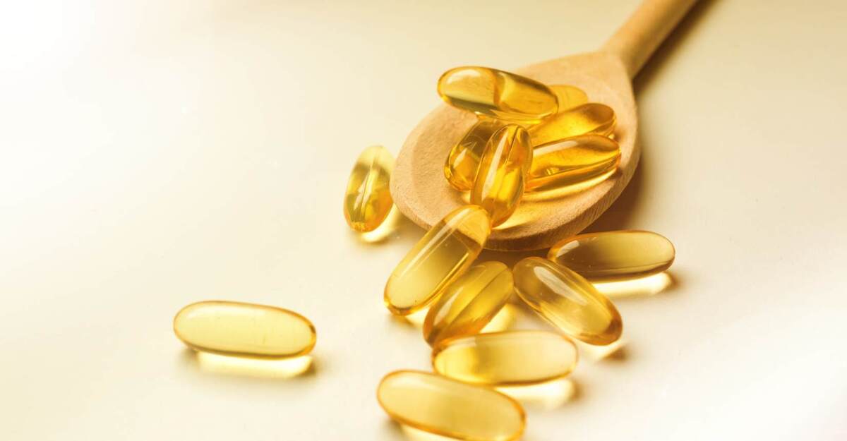 Omega 3 fa male al fegato Un cucchiaio colmo di capsule di omega 3.