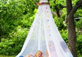 ACCYBH Girls under a mosquito net.
