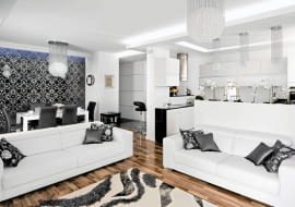 Olśniewająca biel ścian i mebli oraz mnóstwo światła - głównie sztucznego, rzucanego przez liczne lampy. W tej powodzi bieli wyróżniają się tylko czarne i srebrne dodatki. <BR /> MIESZKANIE. Graficzny, biało-czarny wystrój uzupełniają elementy połyskujące srebrem. Z meblami o prostych, nowoczes-nych formach zestawiono ozdobne kryształowe lampy i kinkiety, połyskujące czarno-srebrne poduszki i rolety. Lampy oraz tkaniny gospodarze sprowadzili z Turcji, skąd oboje pochodzą.