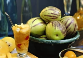 Pepinos in bowl and pepino cocktail (Solanum muricatum)