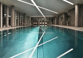 Basen na piętrze rekreacyjnym w apartamentowcu Złota 44.