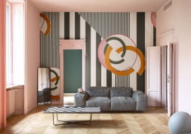 Wariacje na ścianie. Tapetę Cherry Bomb zaprojektował Gio Pagani. Pasy przecinające okręgi tworzą na ścianie nowoczesny deseń. www.wallanddeco.com