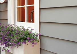 Fiber-cement siding is manufactured to resemble cedar shingles and wood clapboards (either wood-grain or smooth).