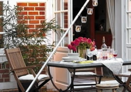 Designerski świecznik ogrodowy z pnia i rury metalowej