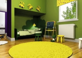 Pokój dziecięcy ze ścianką z łóżkami. Łóżko malucha znajduje się w dolnej wnęce, którą zdobią od góry zabawne dekoracje. W tej części pokoju dominują wesołe barwy.