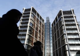 Pedestrians pass new development One Hyde Park in London January 19, 2011. REUTERS/Luke MacGregor (BRITAIN - Tags: BUSINESS)