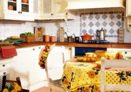 Słoneczny ogród <Br>Bogata paleta żółci, oranżu i brązów. Kompozycja niczym kosz pierwszych jesiennych plonów z wiejskiego ogrodu. <br> Kuchnia swojska i apetyczna jak wrześniowy sad pełen owoców i kwiatów.