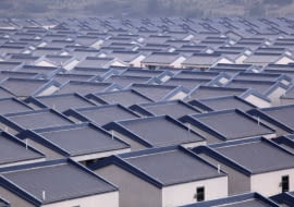 A general view of newly built houses at Dadun village of Lingshui ethnic Li Autonomous County, Hainan province, January 18, 2013. Around 3,500 villagers started to move into 1,029 new houses, each of which measures 253 square meters and took two years to build, according to local reports. Picture taken January 18, 2013. REUTERS/Stringer (CHINA - Tags: SOCIETY BUSINESS CONSTRUCTION) CHINA OUT. NO COMMERCIAL OR EDITORIAL SALES IN CHINA