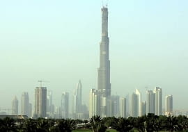 The Burj Dubai tower rises in front of Sheik Zayed highway towers in Dubai, United Arab Emirates, still under construction, Friday, Sept. 14, 2007. The Burj Dubai surpassed Canada's Toronto-based CN Tower on Thursday, which at 1,822 feet, had been the world's tallest free-standing structure since 1976, the developers said. Burj Dubai, the world's tallest building since July, has also become the tallest free-standing structure on earth, reaching 1,822 feet, the developers said. The Dubai Tower's final height is a closely guarded secret, but completion of the concrete, glass and steel structure is expected by the end of 2008. (AP Photo/Kamran Jebreili)