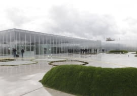 Members of the media work at the site of the Le Louvre Lens Museum, by Japanese architects Kazuyo Sejima and Ryue Nishizawa, on the eve of the inauguration of the museum in Lens, northern France, December 3, 2012. MANDATORY CREDIT Architects Kazuyo Sejima + Ryue Nishizawa SANAA REUTERS/Pascal Rossignol (FRANCE - Tags: SOCIETY MEDIA)