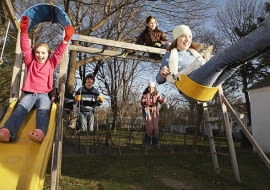 Children Playing in Playground --- Image by Stephen Mallon/Corbis
