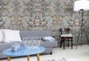 ]Grey living room in minimalist style with sofa, small table, two chairs, desk, and floor lamp