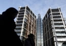 Pedestrians pass new development One Hyde Park in London January 19, 2011. REUTERS/Luke MacGregor (BRITAIN - Tags: BUSINESS)