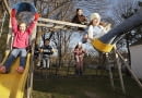 Children Playing in Playground --- Image by Stephen Mallon/Corbis